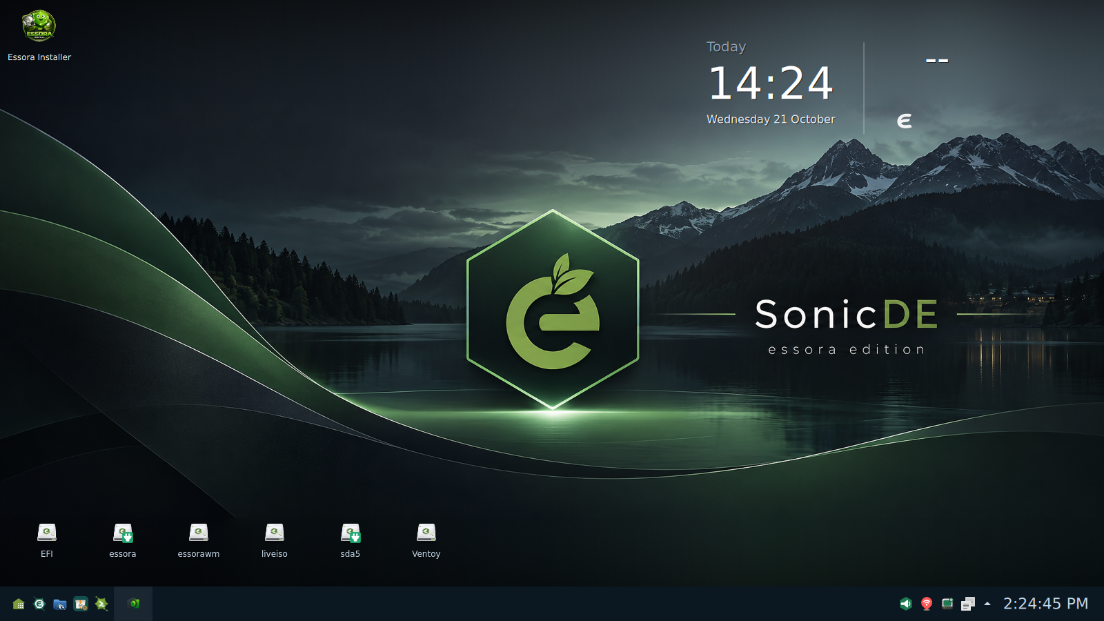 Essora Eos SonicDE desktop with the Essora wallpaper, SonicDE panel, desktop drive icons and desklet